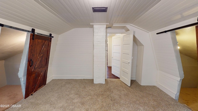 bonus room featuring lofted ceiling and carpet floors