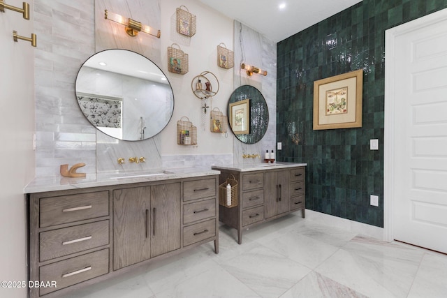 75 Trailmark Ct, Ormond Beach, FL 32174 - bathroom with tile walls, two vanities, marble finish floors, and recessed lighting