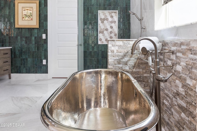 75 Trailmark Ct, Ormond Beach, FL 32174 - bathroom with tile walls and a soaking tub