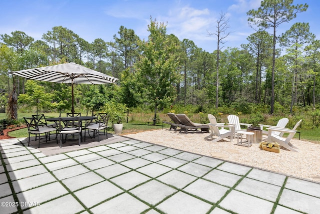 75 Trailmark Ct, Ormond Beach, FL 32174 - view of patio / terrace with a fire pit and outdoor dining area