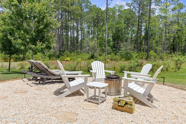 75 Trailmark Ct, Ormond Beach, FL 32174 - view of patio featuring an outdoor fire pit
