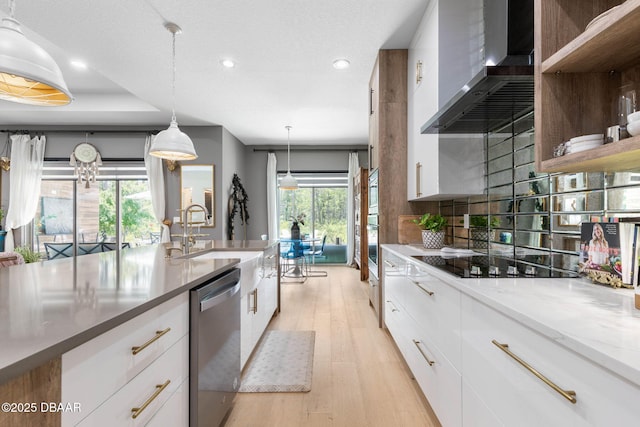 75 Trailmark Ct, Ormond Beach, FL 32174 - kitchen featuring appliances with stainless steel finishes, wall chimney exhaust hood, recessed lighting, white cabinets, and healthy amount of natural light