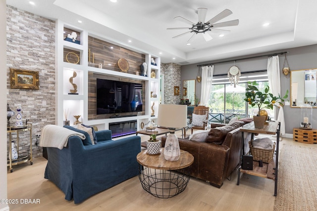 75 Trailmark Ct, Ormond Beach, FL 32174 - living room with a tray ceiling, a ceiling fan, wood finished floors, and recessed lighting