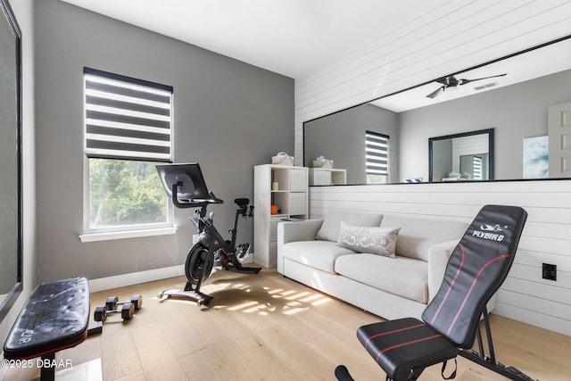 75 Trailmark Ct, Ormond Beach, FL 32174 - workout room featuring wood finished floors, ceiling fan, and wooden walls