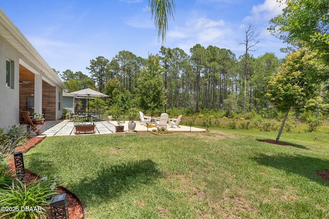 75 Trailmark Ct, Ormond Beach, FL 32174 - view of grassy yard with a patio