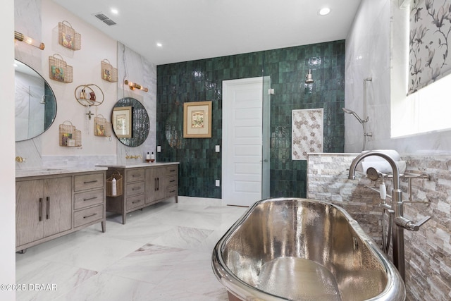 75 Trailmark Ct, Ormond Beach, FL 32174 - full bath with tile walls, a soaking tub, vanity, recessed lighting, and a tile shower