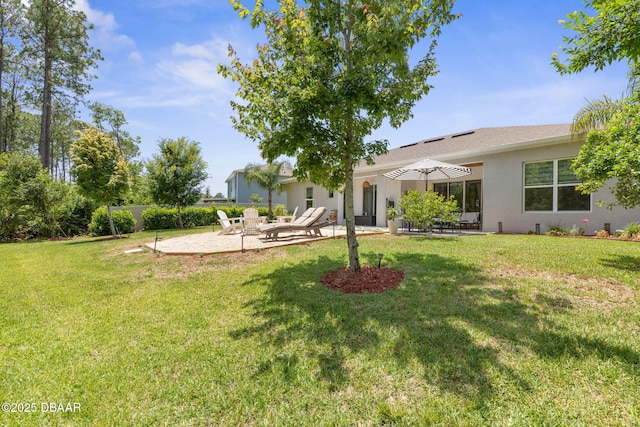 75 Trailmark Ct, Ormond Beach, FL 32174 - view of green lawn featuring a patio area