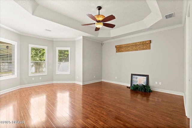 36 Allenwood Look, Ormond Beach, FL 32174 - unfurnished room featuring a tray ceiling, wood finished floors, a ceiling fan, and ornamental molding