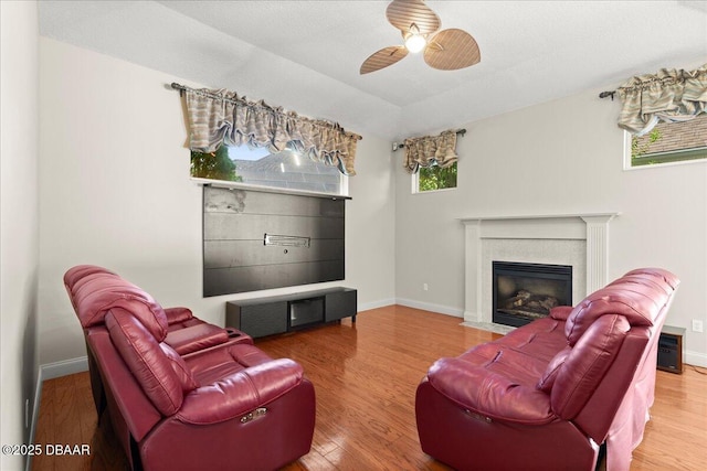 36 Allenwood Look, Ormond Beach, FL 32174 - living room with a fireplace with flush hearth, ceiling fan, plenty of natural light, and wood finished floors