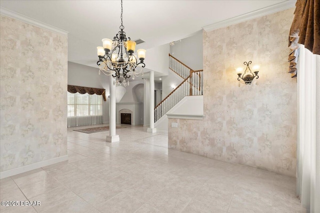 36 Allenwood Look, Ormond Beach, FL 32174 - unfurnished dining area featuring wallpapered walls, a chandelier, stairs, a fireplace, and tile patterned floors