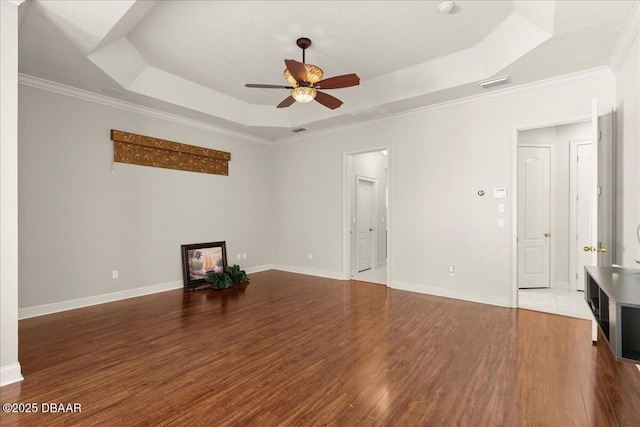 36 Allenwood Look, Ormond Beach, FL 32174 - unfurnished living room with a raised ceiling, ceiling fan, wood finished floors, and crown molding
