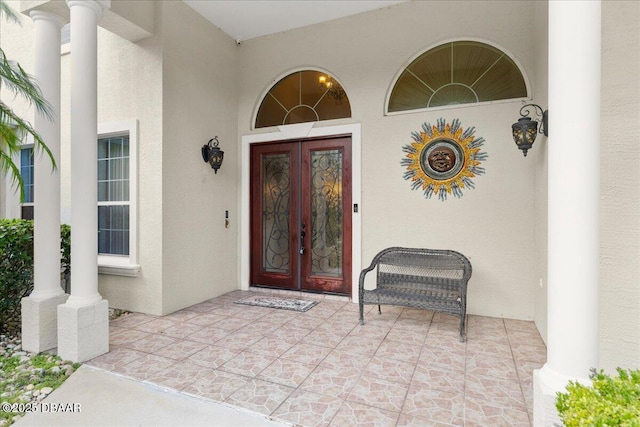 36 Allenwood Look, Ormond Beach, FL 32174 - property entrance featuring french doors and stucco siding