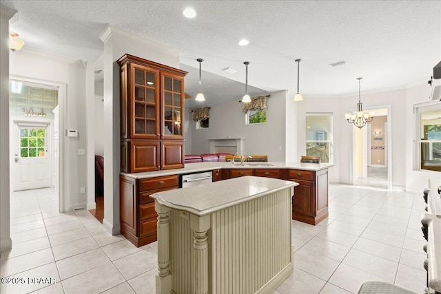36 Allenwood Look, Ormond Beach, FL 32174 - kitchen with light tile patterned floors, crown molding, light countertops, a peninsula, and a chandelier