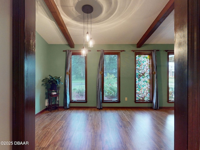 108 Dee St, New Smyrna Beach, FL 32168 - unfurnished room featuring wood finished floors, baseboards, and beam ceiling