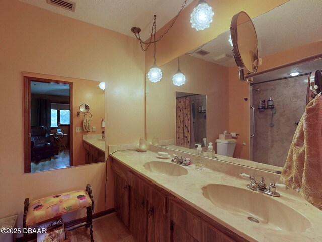 108 Dee St, New Smyrna Beach, FL 32168 - full bath featuring double vanity, toilet, a shower, and wood finished floors
