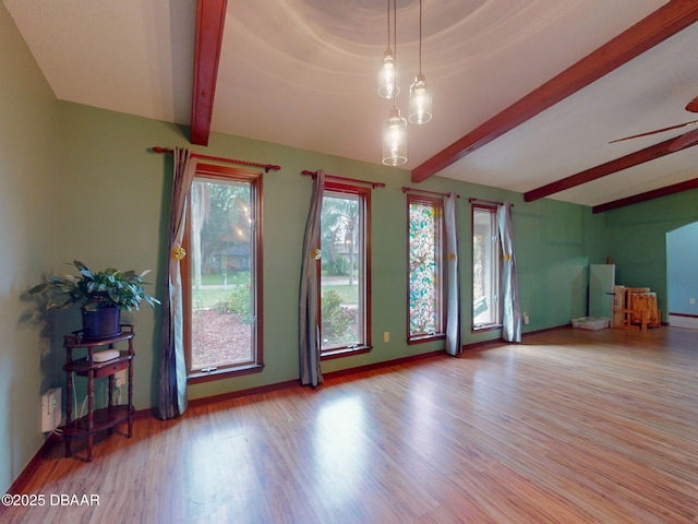 108 Dee St, New Smyrna Beach, FL 32168 - unfurnished living room with wood finished floors, baseboards, and ceiling fan