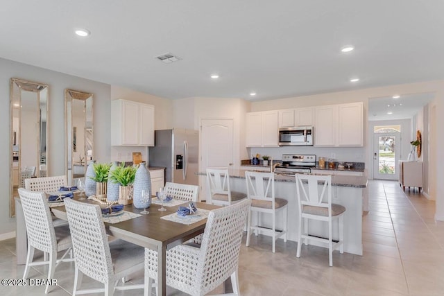 dining room with light tile patterned floors