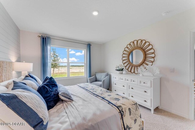 bedroom featuring light carpet