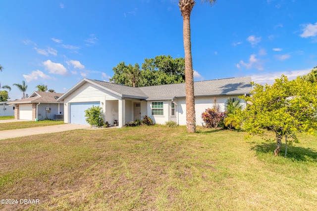 ranch-style home featuring a garage and a front lawn