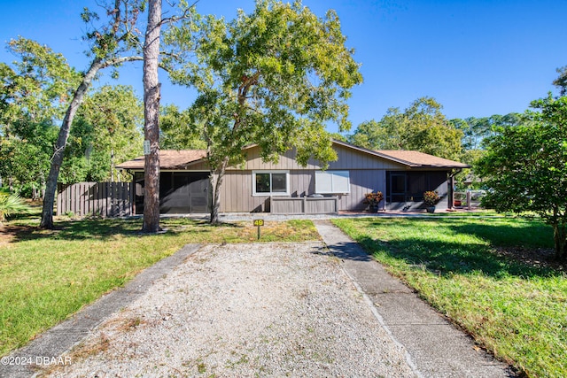 ranch-style home with a front yard