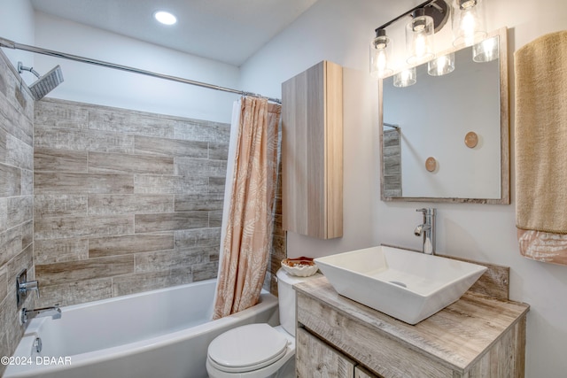 full bathroom featuring shower / bath combo, toilet, and vanity