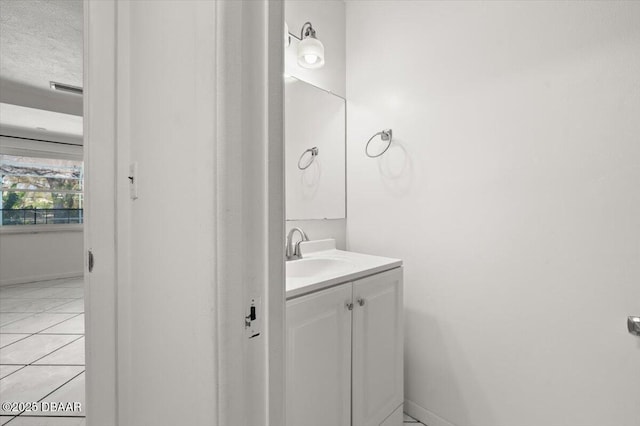 14 Woodlake Dr, Port Orange, FL 32129 - bathroom featuring vanity, baseboards, and tile patterned flooring