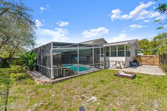 14 Woodlake Dr, Port Orange, FL 32129 - back of house featuring a patio, a gate, and a lanai