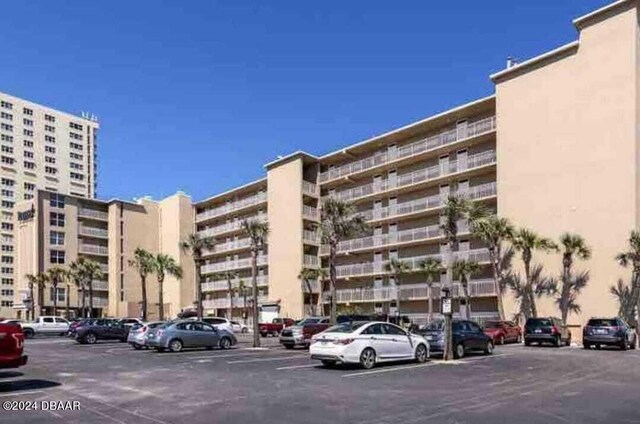 3501 S Atlantic Ave Unit 503, Daytona Beach, FL 32118 - view of apartment building / complex with uncovered parking