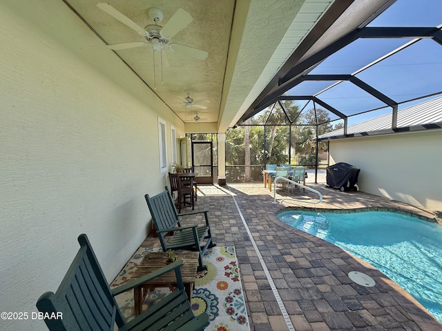2048 S Daytona Ave, Flagler Beach, FL 32136 - outdoor pool with a patio area, a ceiling fan, and glass enclosure