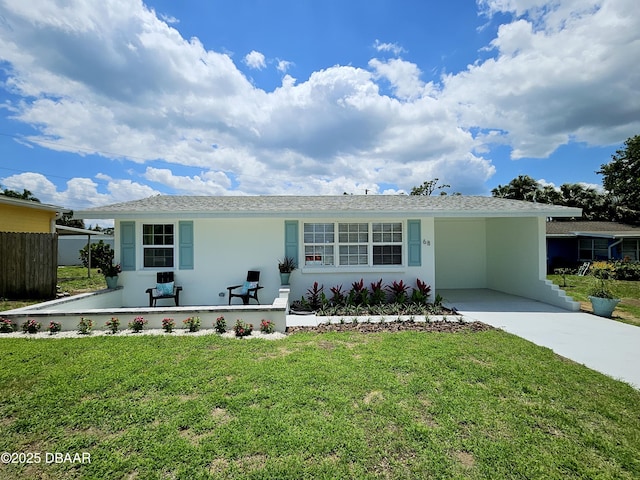 single story home with driveway, stucco siding, and a carport