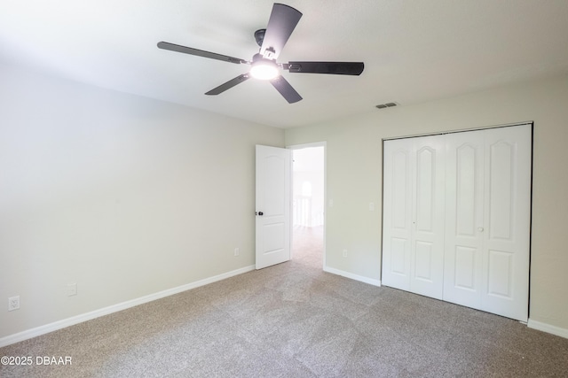 15 Misners Trl, Ormond Beach, FL 32174 - unfurnished bedroom featuring carpet flooring, a closet, baseboards, and a ceiling fan