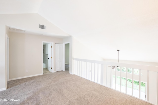 15 Misners Trl, Ormond Beach, FL 32174 - unfurnished room with lofted ceiling, carpet floors, and baseboards