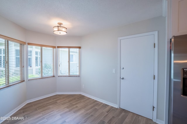 15 Misners Trl, Ormond Beach, FL 32174 - unfurnished dining area with healthy amount of natural light, wood finished floors, and baseboards