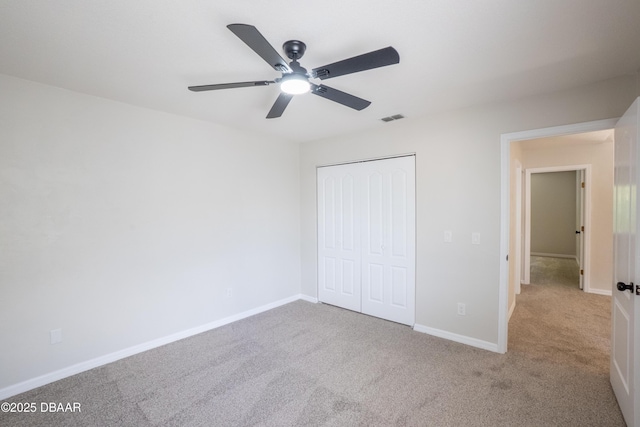 15 Misners Trl, Ormond Beach, FL 32174 - unfurnished bedroom with carpet flooring, a closet, baseboards, and a ceiling fan