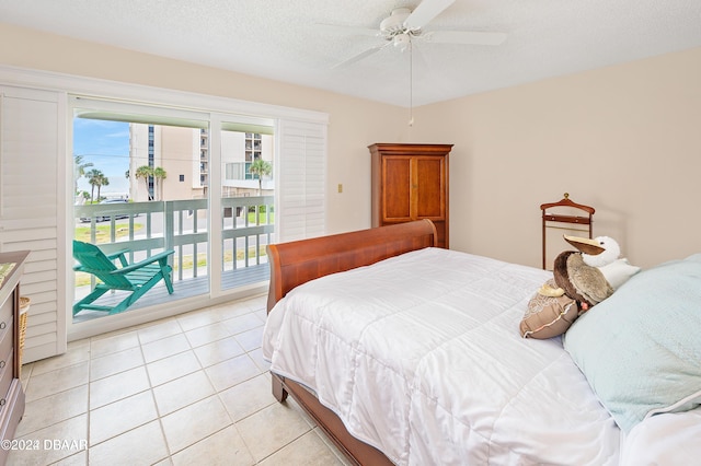 tiled bedroom with ceiling fan, a textured ceiling, and access to outside