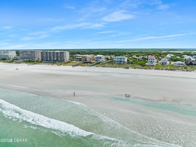 aerial view with a water view and a view of the beach