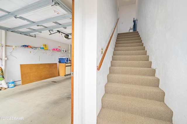 stairway with concrete floors