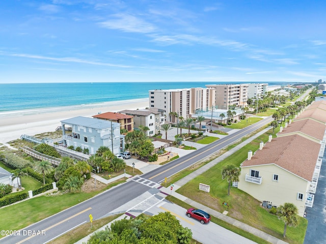 birds eye view of property featuring a water view and a view of the beach