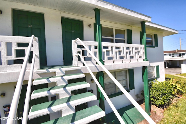 view of exterior entry with covered porch