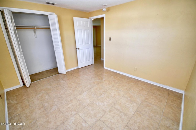 unfurnished bedroom featuring a closet