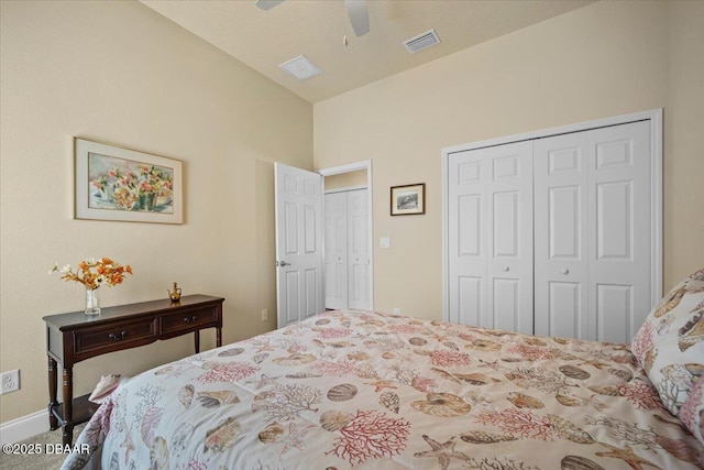 carpeted bedroom with lofted ceiling, visible vents, and a ceiling fan