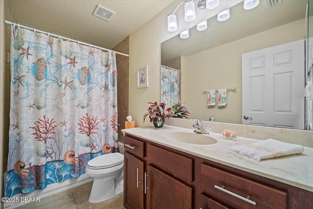 full bathroom featuring visible vents, toilet, tile patterned flooring, a textured ceiling, and vanity