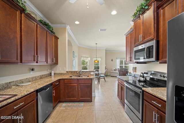 kitchen featuring visible vents, appliances with stainless steel finishes, a sink, and ornamental molding