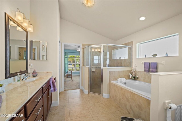 full bathroom with a garden tub, tile patterned flooring, vaulted ceiling, vanity, and a shower stall