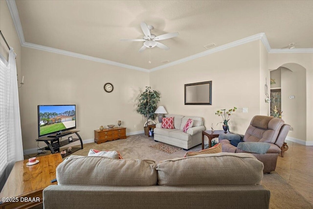 living area with arched walkways, crown molding, and baseboards