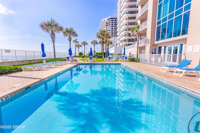 view of swimming pool with a patio area