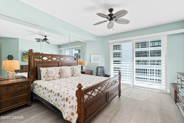 bedroom featuring ceiling fan, access to outside, and light wood-type flooring