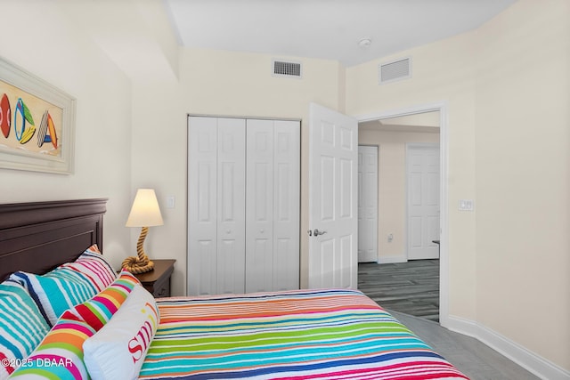 bedroom featuring a closet and dark hardwood / wood-style floors