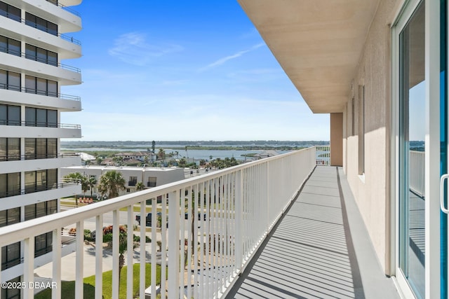 balcony featuring a water view