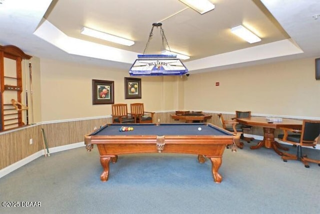 rec room with a raised ceiling, billiards, and carpet